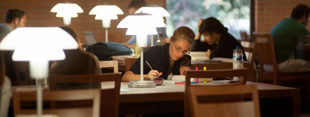 student studying in law library